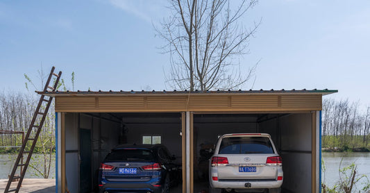 Spacious double garage housing a BMW and Toyota next to a scenic river.