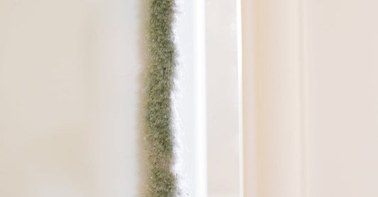 Detailed view of insulation material on a wall in a minimalist interior setting.
