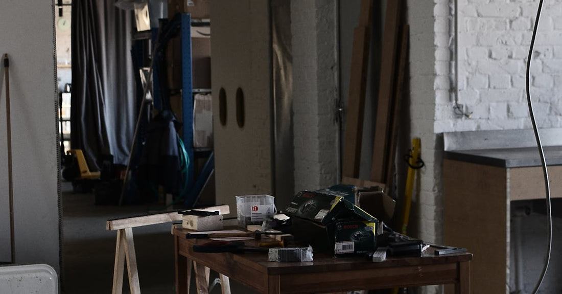 Interior of spacious modern studio with white brick walls and lighting equipment with wires placed on table in contemporary workplace