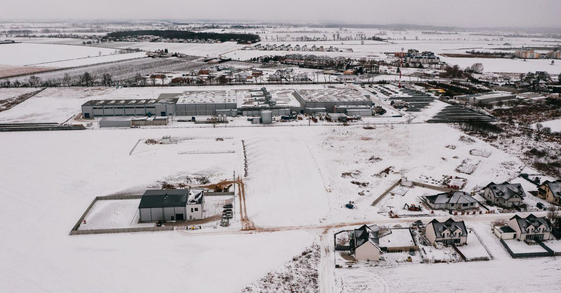 Drone shot of a snow-covered industrial estate in Poznań, Poland.